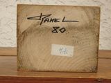 a picture of a picture of a wood block with a name on it