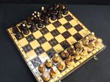 a chess board that has a lot of chess pieces on it
