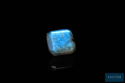 a blue labradorite stone on a black background
