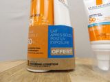 a tube of sunscreen cream next to a tube of sunscreen cream