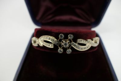 a ring that is in a velvet case on a table