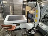 an image of a machine in a factory with a solar panel on it