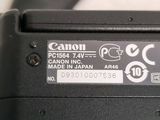 a close up view of a canon camera with the battery on