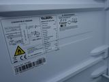a close up of a white refrigerator with a label on it