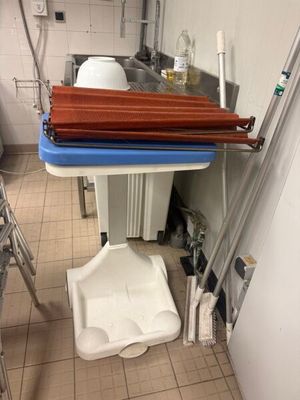an image of a kitchen with a sink and a toilet
