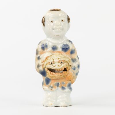 a figurine of a man with a smile on his face