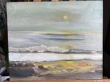 an oil painting of a painting of a beach scene on a easel