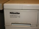 a white washer sitting on top of a counter