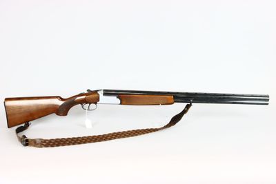 a rifle with a gun on a white background