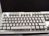a computer keyboard sitting on top of a desk