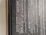 a close up of a book on a table with a white background