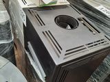 a microwave sitting on top of a pallet in a room