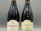 two bottles of wine are sitting next to each other on a table