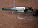 a gun that is sitting on top of a plastic case