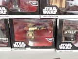 several star wars action figures are on display in a store