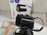 a black and silver electric hand blender on a counter