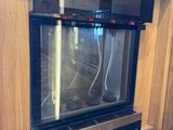 a microwave built into the wall in the kitchen