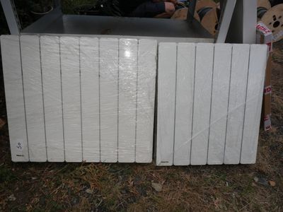 a lot of white boards stacked on top of each other