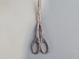 a pair of scissors that are sitting on a table