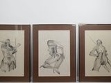 three framed drawings of a man holding a baseball bat and a woman holding a baseball bat