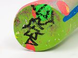 a picture of a painted baseball bat on a white surface