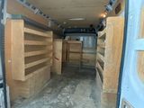 a white van that is parked inside of a building