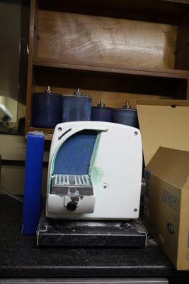 a white toaster sitting on a counter next to a box of candles