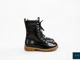 a close up of a pair of black boots on a white background