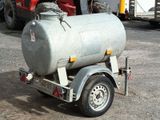 a trailer with a tank attached to the back of it