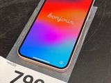 an iphone x is sitting on top of a box with a price tag on it