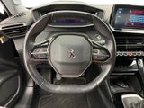 the interior of a car with a steering wheel and dashboard controls