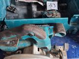 a blue tool box with tools in it on a table