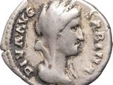 a silver coin with a woman ' s head on it