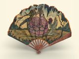 a fan with a painting on it that has a man and a woman on it