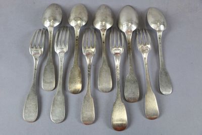 six forks and six spoons are arranged in a row on a table