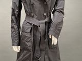 an image of a mannequin dressed in a trench coat