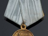 an image of a medal with a ribbon on a black background