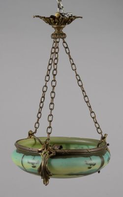 an image of a green glass bowl hanging from a chain