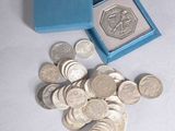 a small blue box with some silver coins in it