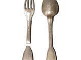 two spoons and a fork sitting next to each other