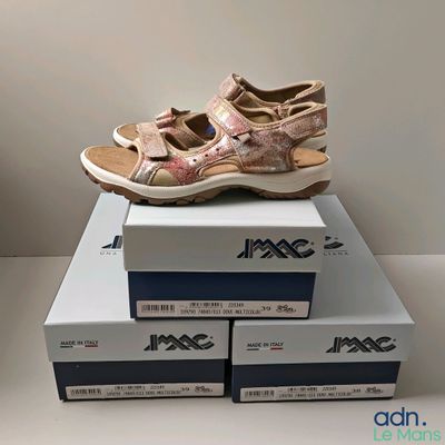 a pair of shoes that are on top of a box