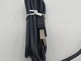 a cable connected to a computer mouse on a table