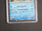 a pokemon card in a plastic container on a table