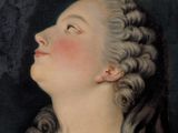 portrait of a woman with braid hair and a pink dress