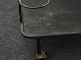 an image of a small metal cart with wheels