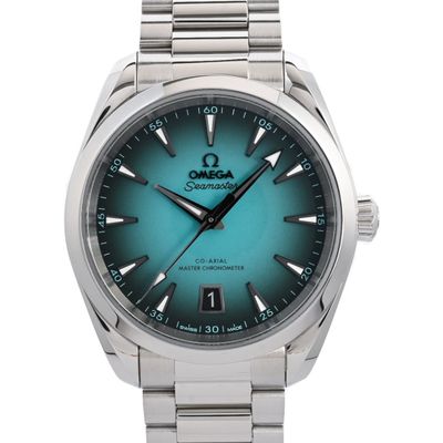 a close up of a watch on a white background with a blue dial