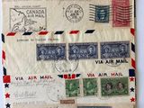 several old envelopes with stamps and stamps on them on a table