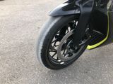 a close up of a motorcycle parked in a parking lot