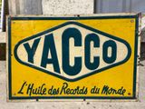 a yellow and green sign that says yacco