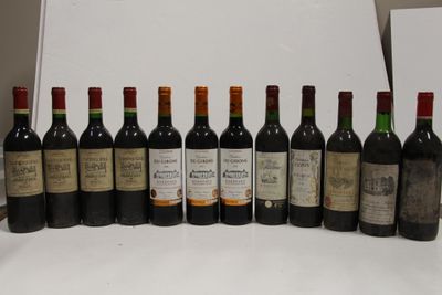 several bottles of wine are lined up in a row on a table